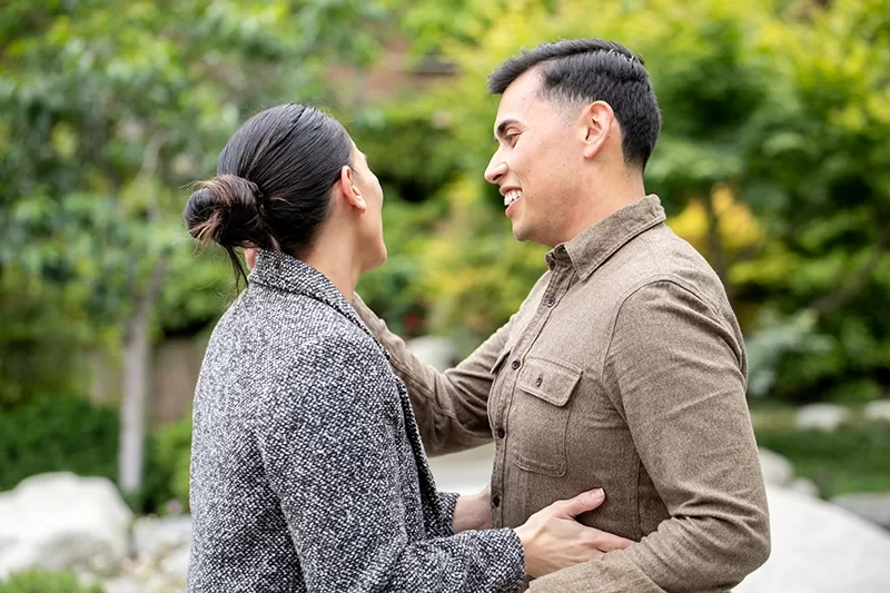 Happy couple celebrating their surprise proposal